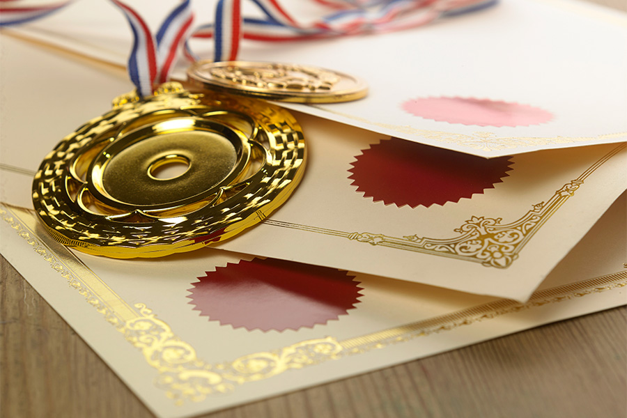 close up certificate medal wooden table