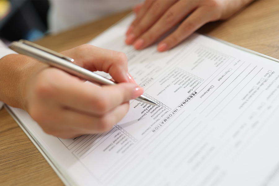 closeup woman writing personal information